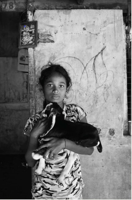 Child born into a settlement for displaced people over a decade after the end of Sri Lanka's civil war