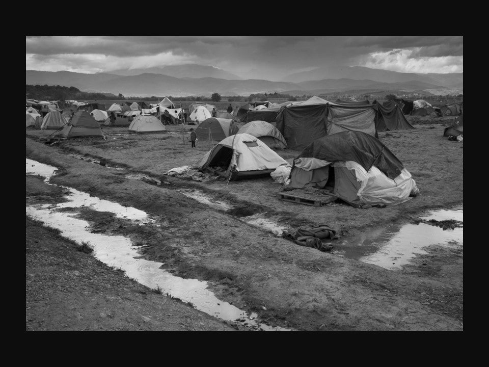 An informal refugee camp for Syrians by the closed Greek border with Macedonia